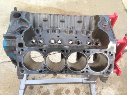 1979 Ford Bronco - This engine block, likely for a V8, is mounted on an engine stand, ready for rebuild or inspection.