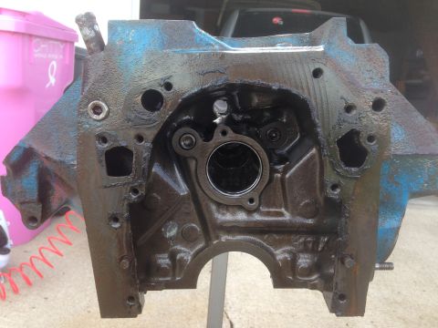1979 Ford Bronco - This is a close-up view of a greasy engine block, likely undergoing maintenance or rebuild.
