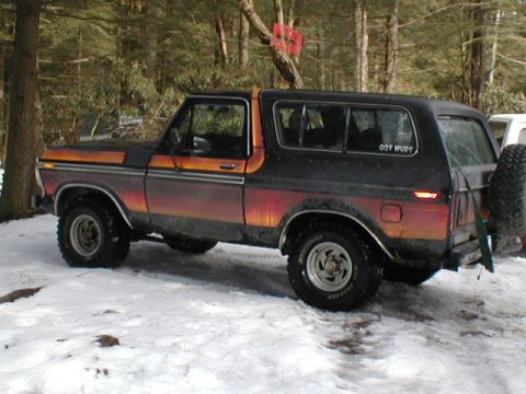 1979 Ford Bronco II - This 1979 Ford Bronco II features a distinctive two-tone paint scheme and a 'GOT MUD?' sticker on the rear window.
