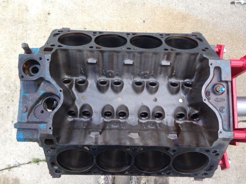 1979 Ford Bronco - Engine block on a red stand, likely for rebuild or repair.