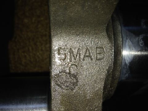 1979 Ford Bronco - Close-up of an engine part showing casting numbers 5MAB and 010, likely from a Ford vehicle.