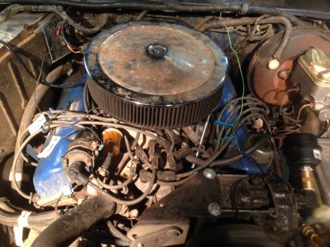 1979 Ford Bronco - Close-up view of an engine bay, showing various components and wiring, with a watermark at the bottom right.