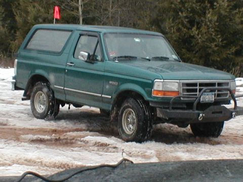 1979 Ford Bronco II - This 1992 Ford Bronco is equipped with an aftermarket bumper and winch, navigating snowy conditions.