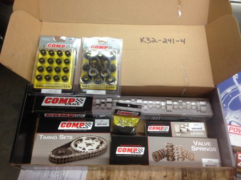 1979 Ford Bronco - A collection of Comp Cams engine components, including a timing set, valve springs, and lifters, are neatly arranged in a cardboard box.