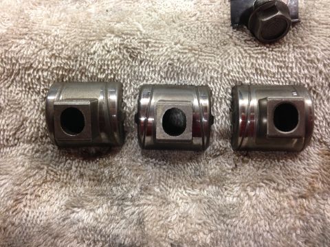 1979 Ford Bronco - Engine valve lifters shown on a towel, with a bolt in the background.