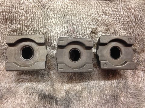 1979 Ford Bronco - Three engine bearing caps are shown, likely for a rebuild or repair project.