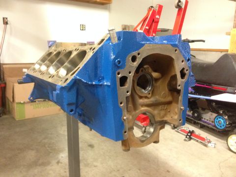 1979 Ford Bronco - Engine block painted blue and mounted on a stand, likely for an engine rebuild project.