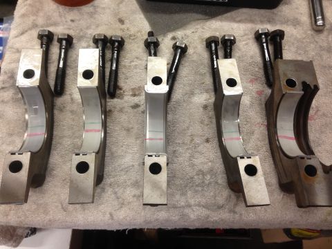 1979 Ford Bronco - Engine bearing caps and bolts are laid out on a towel, likely for an engine rebuild.