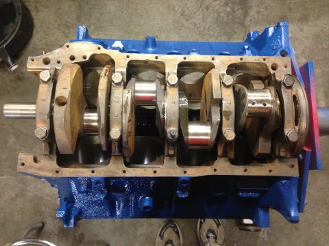 1979 Ford Bronco - The engine block and crankshaft are visible in this close-up shot, with the block painted a bright blue.