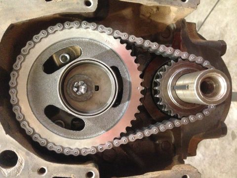 1979 Ford Bronco - Close-up view of an engine's timing chain and gears, indicating internal engine components.