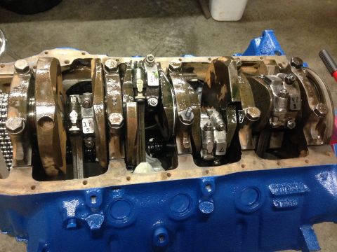 1979 Ford Bronco - Close-up view of an engine's crankshaft and connecting rods during a rebuild.