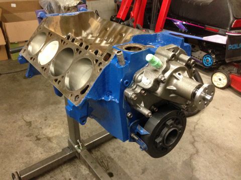 1979 Ford Bronco - Engine block on a stand, showing the water pump and pulley assembly.