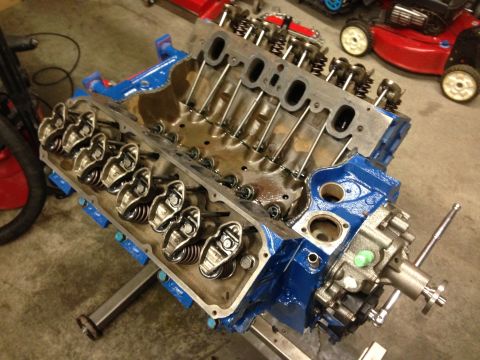 1979 Ford Bronco - The internal components of a V8 engine are visible after the valve covers have been removed.