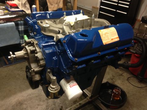 1979 Ford Bronco - Engine on stand, likely undergoing rebuild or maintenance. Oil filter and fuel pump are attached.