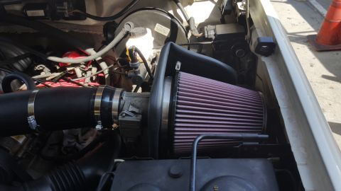 1995 Ford Bronco - Aftermarket K&N air intake system installed in the engine bay.