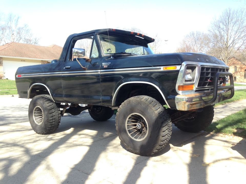 Black lifted Ford Bronco parked on a driveway