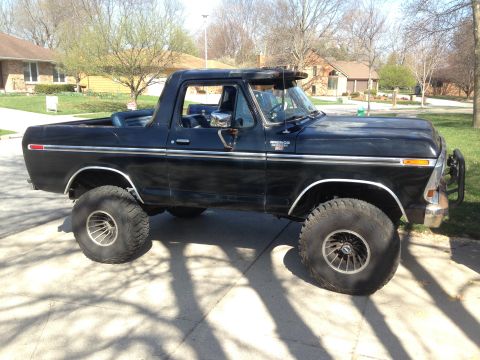 1979 Ford Bronco - This black 1979 Ford Bronco is modified with large off-road tires and lifted suspension.