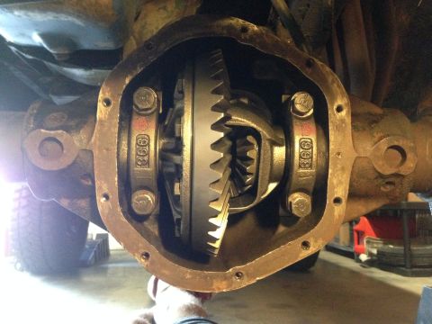 1979 Ford Bronco - Close-up of an open differential housing, showing internal gears and stamped bearing caps.