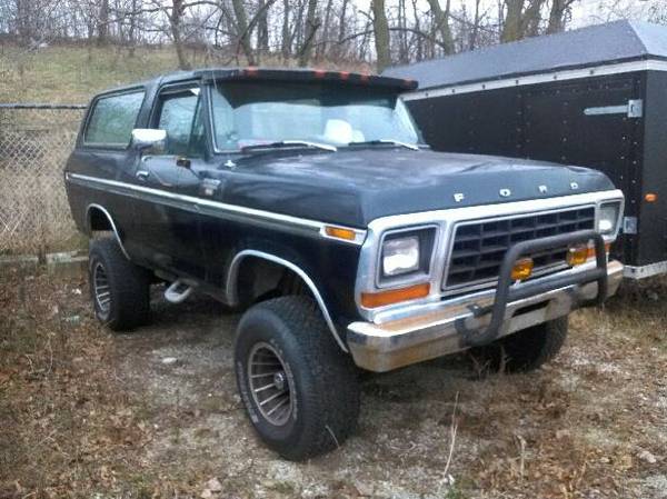 Black Ford Bronco with a chrome grille and bumper guard