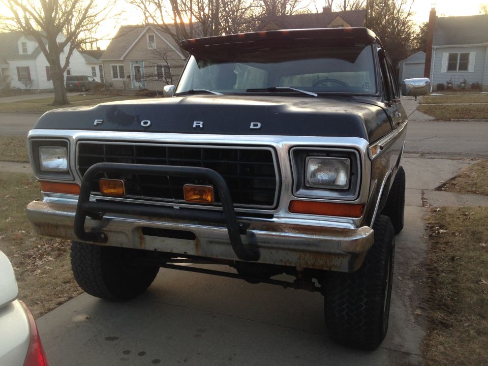 Black 1978 Ford Bronco with a chrome grille guard and a sun visor