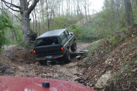 1979 Ford Bronco - Off-road adventure in a classic Ford Bronco on a challenging dirt path.