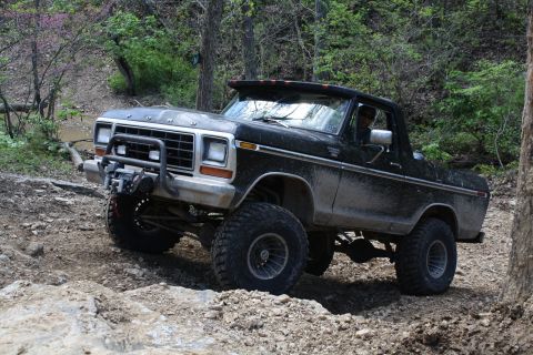 1979 Ford Bronco - Modified Ford Bronco navigating a challenging off-road course.