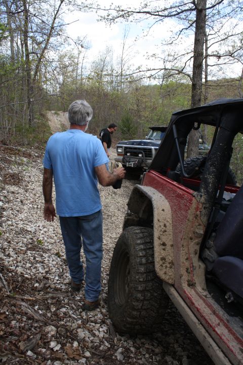 1979 Ford Bronco - A 1979 Ford Bronco is seen on a gravel path with off-road tires and a winch on the bumper.