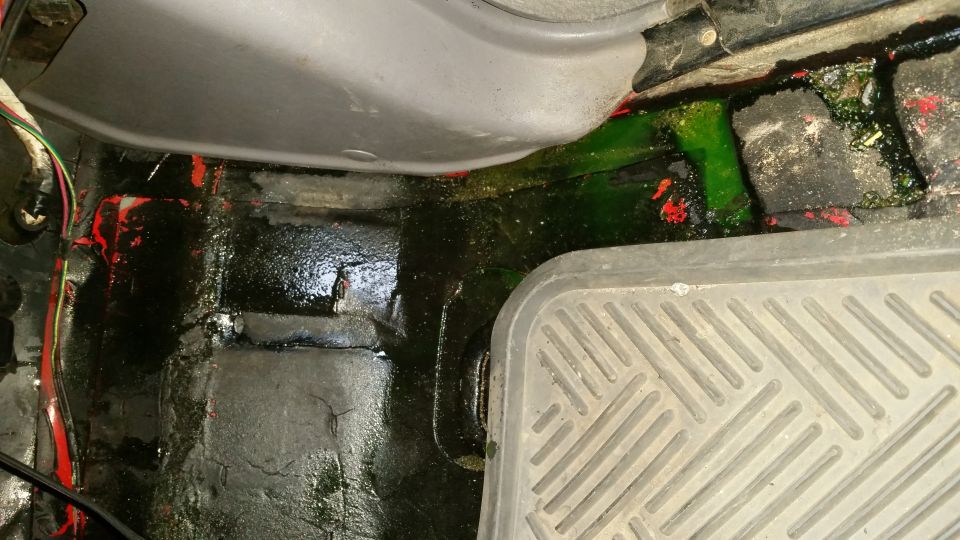 Green fluid leak on vehicle floor mat