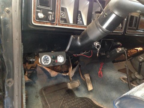1979 Ford Bronco - Aftermarket gauges and dashboard details visible inside a vehicle's cabin.