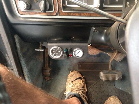 1979 Ford Bronco - A custom gauge pod with two analog gauges and indicator lights is mounted below the dashboard.