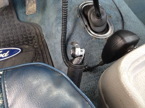 1979 Ford Bronco - Interior view of a 1979 Ford Bronco, a Ford branded floor mat and CB radio.