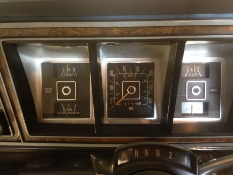 1979 Ford Bronco - Close-up of the instrument cluster, including the speedometer, fuel gauge, and temperature gauge.