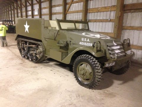 1979 Ford Bronco - This M3 Half Track displays military markings and tracks, clearly not a 1979 Ford Bronco.