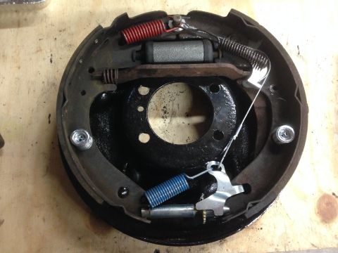1979 Ford Bronco - Close-up view of a drum brake assembly, showing internal components and springs.