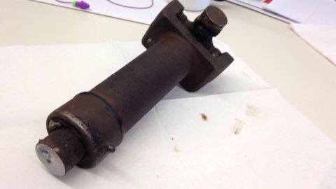 1979 Ford Bronco - A rusty driveshaft component rests on a paper towel, showing signs of wear and tear.