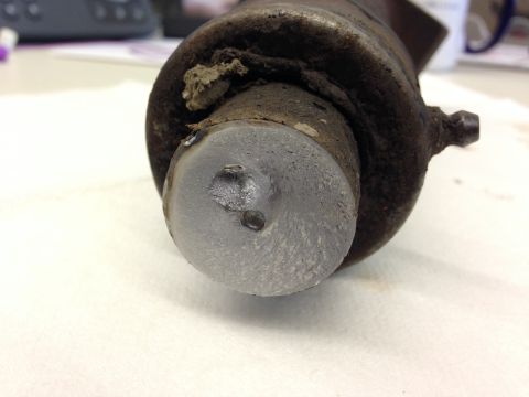 1979 Ford Bronco - Close-up view of a brake wheel cylinder showing wear on the piston and interior housing.