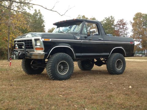 1979 Ford Bronco - This lifted 1979 Ford Bronco features aggressive off-road tires and a front-mounted winch, ready for adventure.