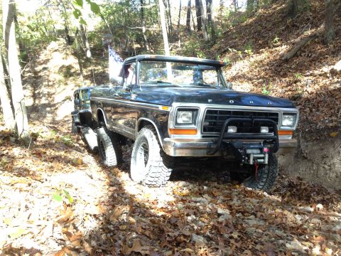 1979 Ford Bronco - This modified Ford Bronco navigates a wooded trail during the fall season.