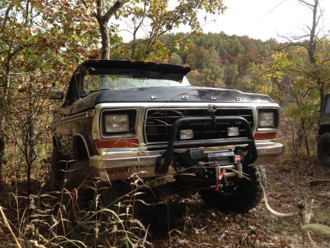 1979 Ford Bronco - This 1979 Ford Bronco is equipped with a winch and brush guard, seen off-road in the fall.