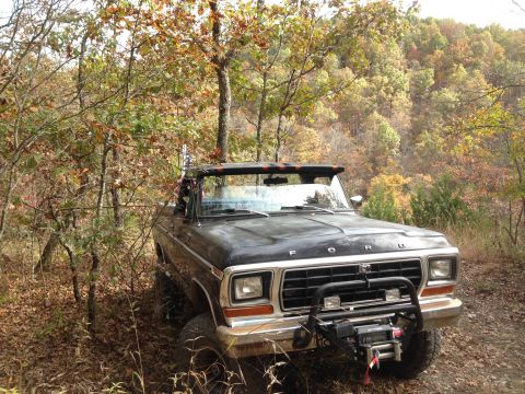 1979 Ford Bronco - 1979 Ford Bronco off-road in the woods during fall.