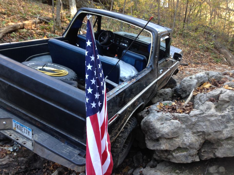 1979 Ford Bronco interior with blue seats and American flag