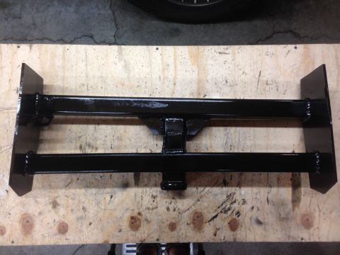 1979 Ford Bronco - A black painted trailer hitch receiver assembly is shown mounted on a wooden surface. The assembly features two horizontal bars connected b…