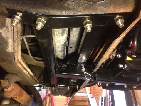 1979 Ford Bronco - Close-up view of a newly installed winch mount bracket on a vehicle's undercarriage.