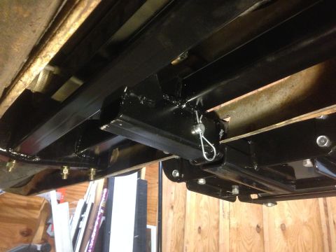 1979 Ford Bronco - Close-up view of a winch mount assembly attached to the undercarriage of a vehicle.