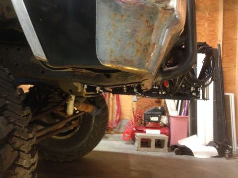 1979 Ford Bronco - Close-up of a vehicle's undercarriage, focusing on the winch mount assembly.