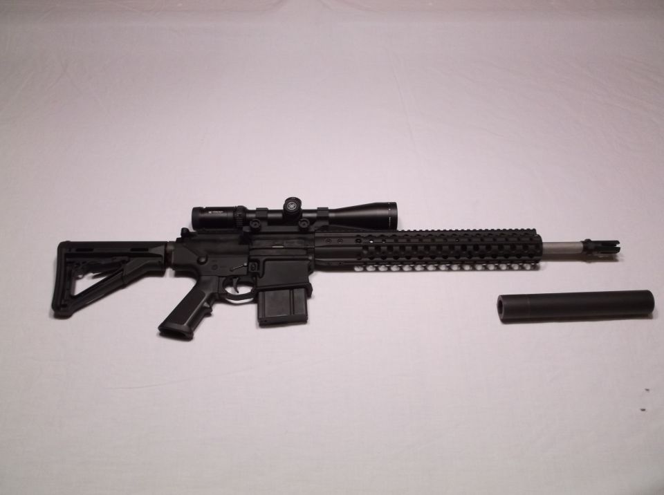 Rifle with scope and suppressor