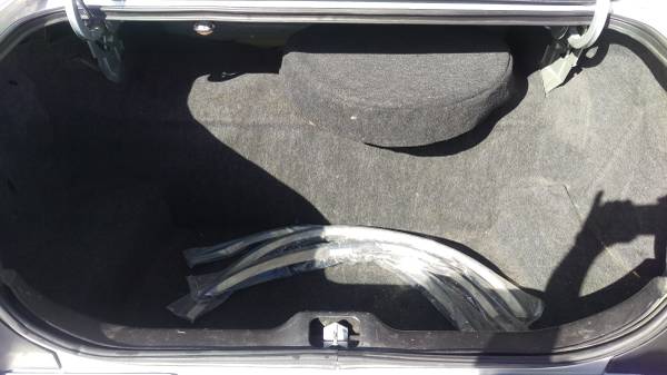 Open carpeted car trunk interior