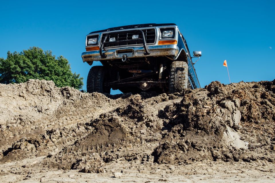 1979 Ford Bronco climbing a dirt hill
