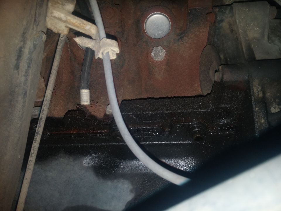 Photo of underbody frame, brake line and engine pan