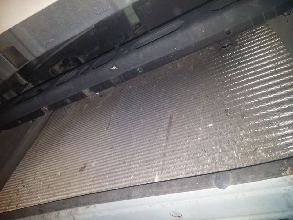 Photo of a dirty radiator and condenser core
